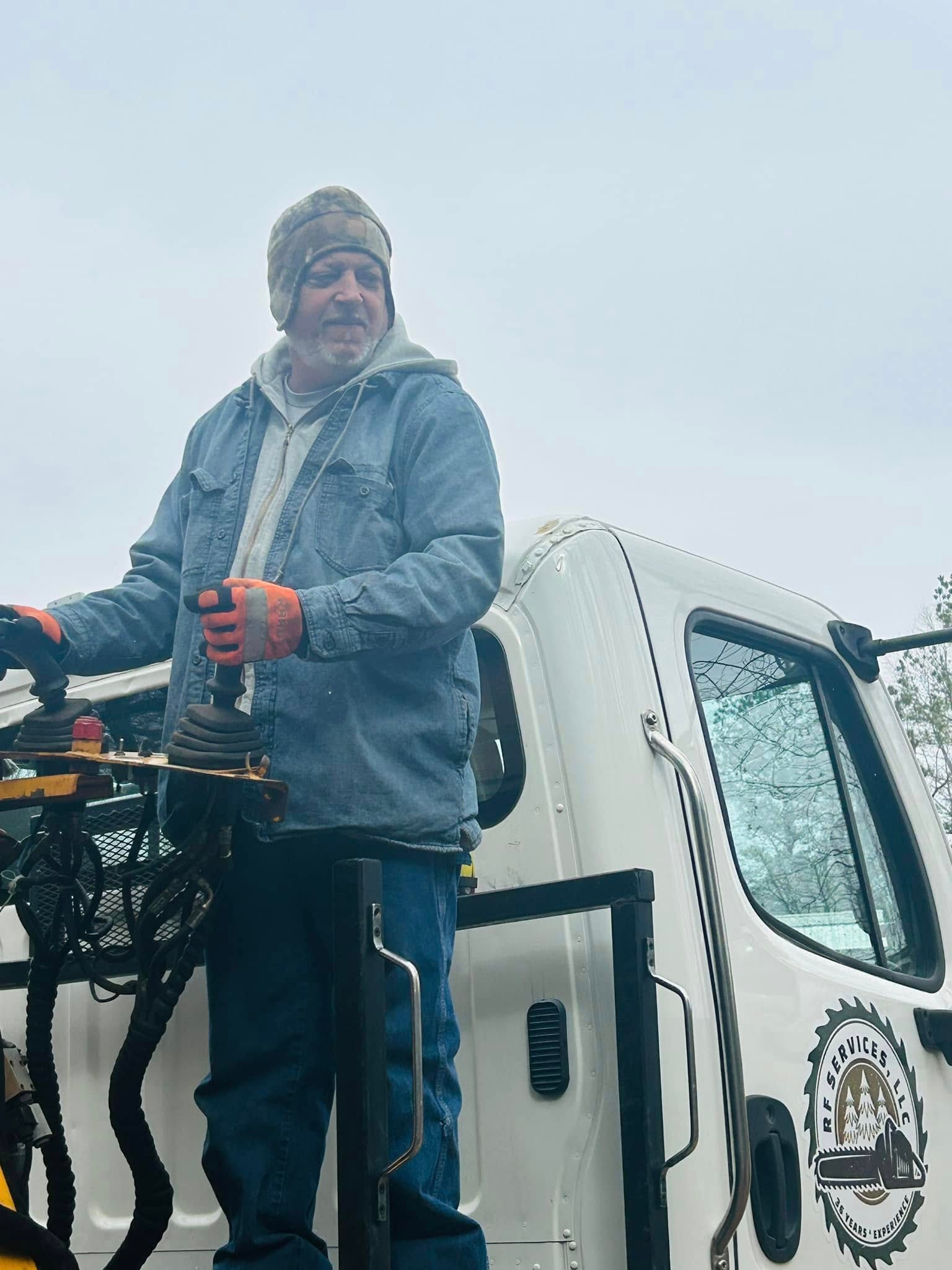 RF Services crew member on truck with equipment