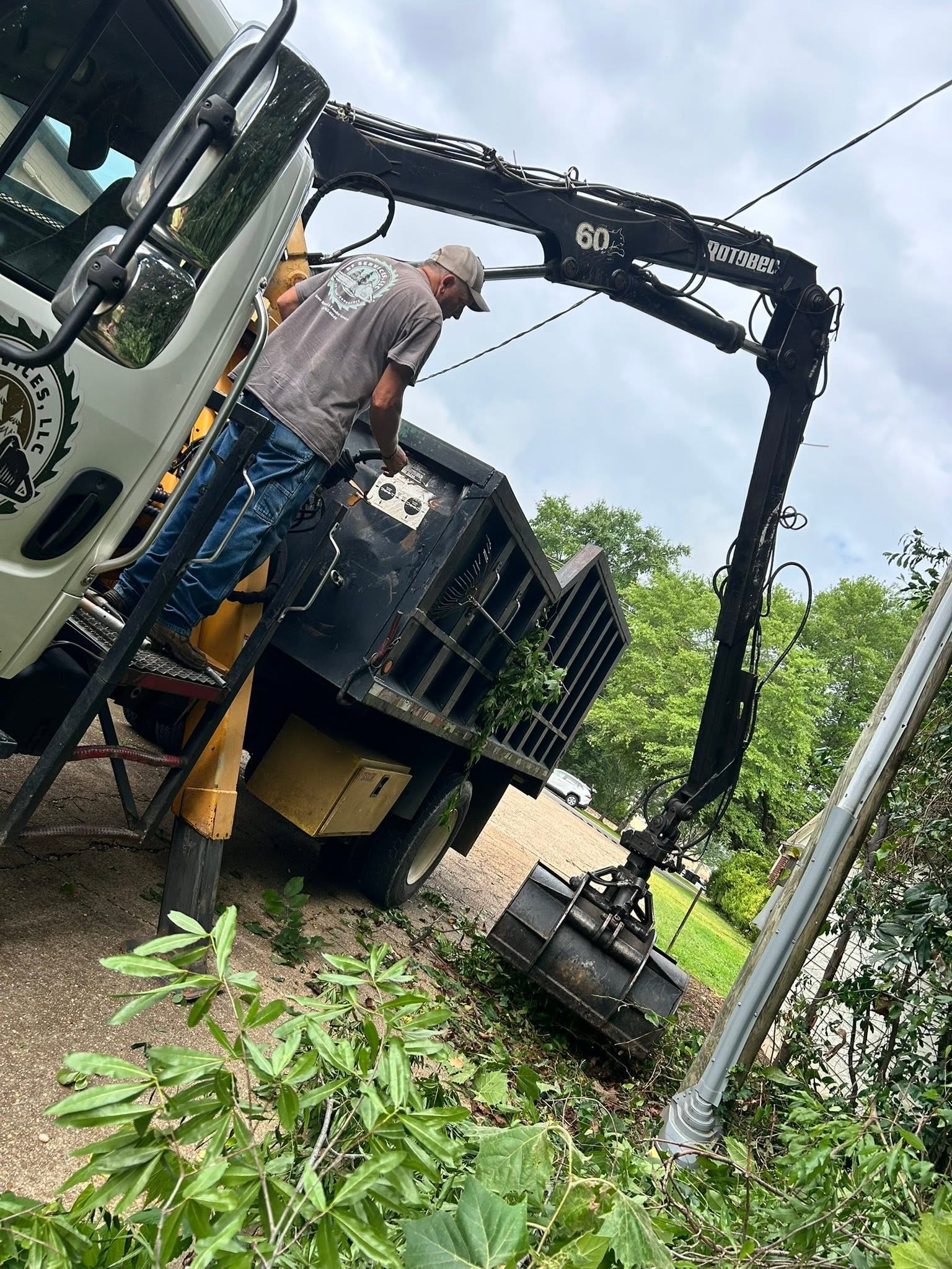 Robert Finnen operating the RF Services grapple loader on job site