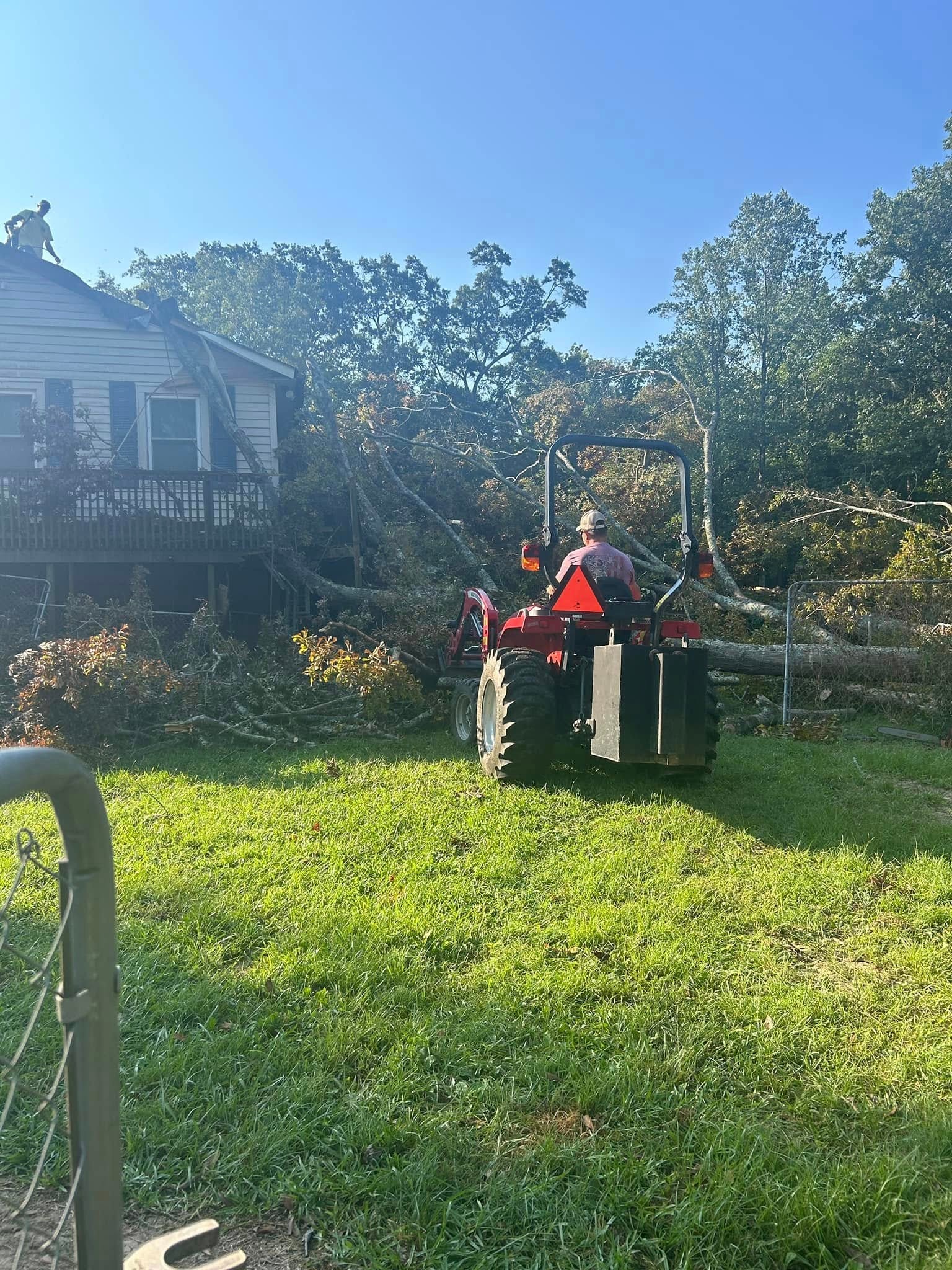 RF Services tractor clearing storm debris
